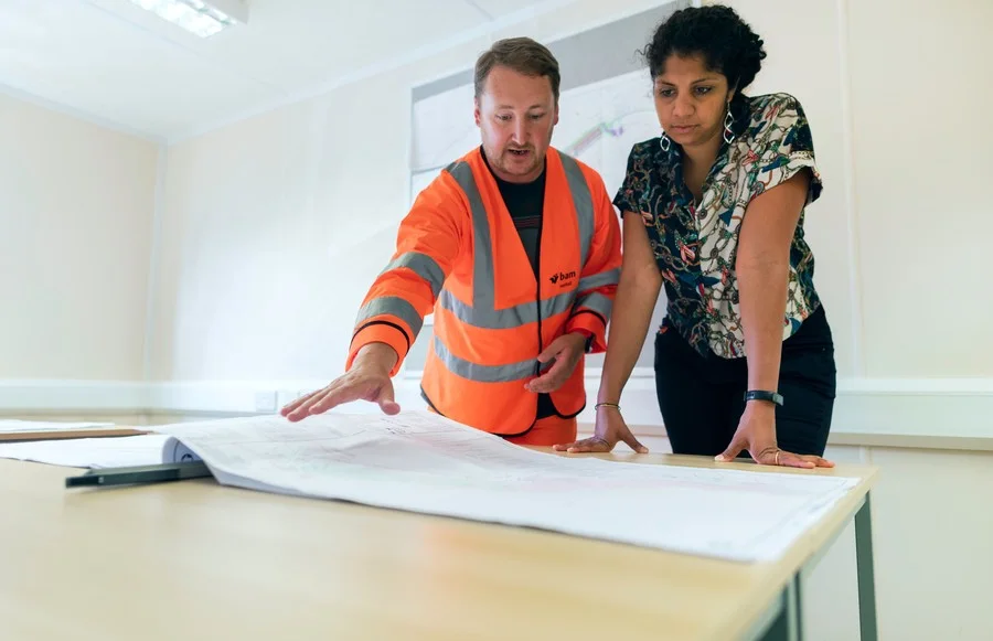 Engineering Inputs Before Quotation Engineers reviewing project blueprints before preparing a quotation