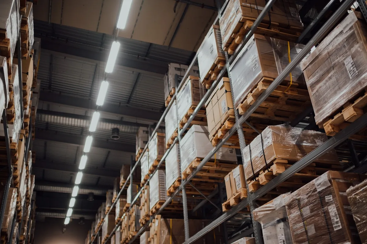 Packaged goods on warehouse racking (placeholder -- Unsplash)